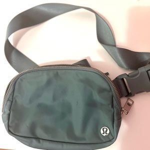 Light green Lululemon Belt bag.